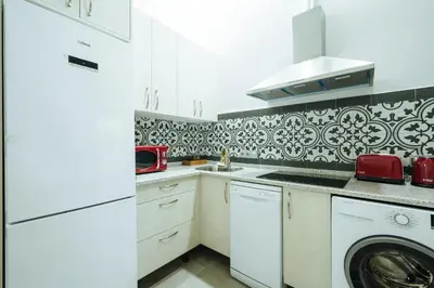 Una cocina o zona de cocina en Apartamentos Trinidad
