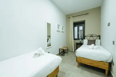 Cama o camas de una habitación en Apartamentos Trinidad