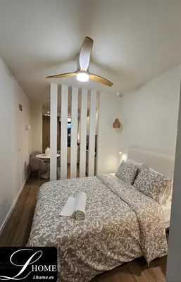 Cama o camas de una habitación en LHOME Puerta Osario Centro Ciudad