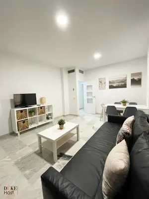 Una televisión o centro de entretenimiento en Macarena Apartment