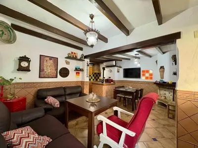 Una televisión o centro de entretenimiento en Villa Sol