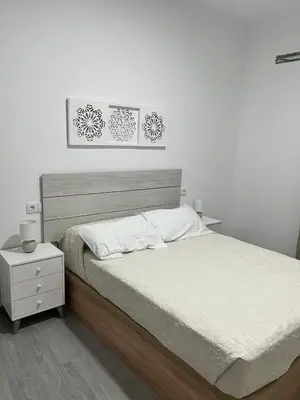 Cama o camas de una habitación en Apartamento El Rincón del Olivar III