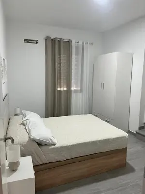 Cama o camas de una habitación en Apartamento El Rincón del Olivar III