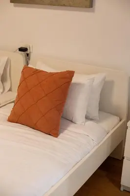 Cama o camas de una habitación en GoToSeville Talavera Suites