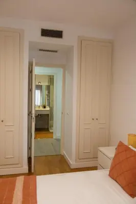 Cama o camas de una habitación en GoToSeville Talavera Suites