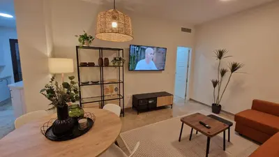 Una televisión o centro de entretenimiento en apartamento Écija Torcal