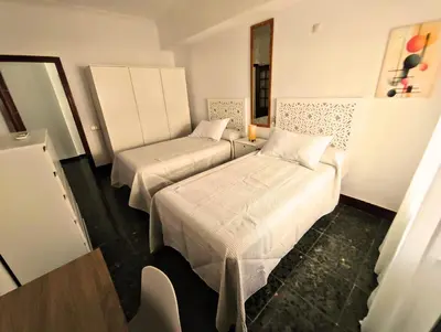 Cama o camas de una habitación en Ronda Suite, Parking gratuito cercano