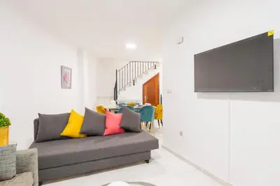 Una televisión o centro de entretenimiento en Casa Sol Duplex 3 Rooms Terrazas