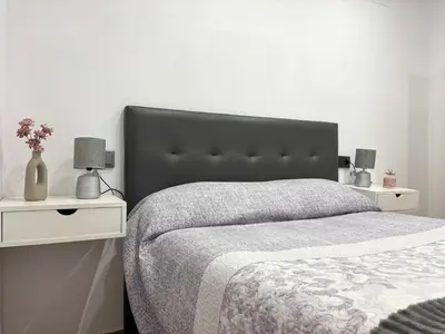 Cama o camas de una habitación en La Cordobesa Suites