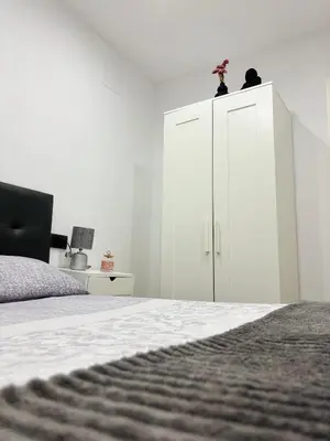 Una televisión o centro de entretenimiento en La Cordobesa Suites