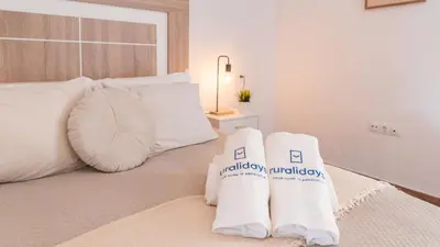 Cama o camas de una habitación en Los Cortinales Setenil de las Bodegas by Ruralidays