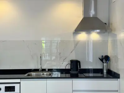Una cocina o zona de cocina en Apartamento Reina Centro Suite