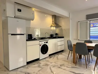 Una cocina o zona de cocina en Apartamento Reina Centro Suite