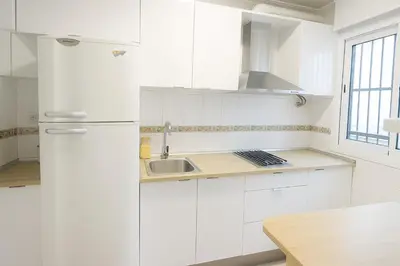 Una cocina o zona de cocina en RentalSevilla Hiniesta