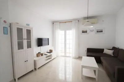 Una televisión o centro de entretenimiento en Apartamento El Indiano