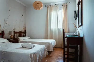 Cama o camas de una habitación en Hostal Boutique El Rey del Sol