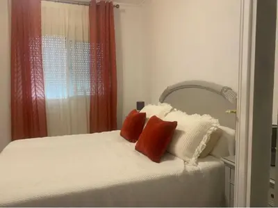 Cama o camas de una habitación en Casa amplia a un paso de Sevilla