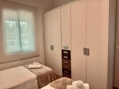 Cama o camas de una habitación en Alojamiento turístico Puerta del Puente Romano