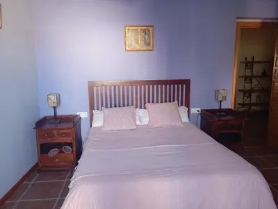 Cama o camas de una habitación en La casa de Alanís de la sierra
