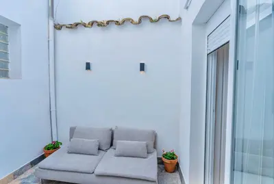 Zona de estar de Deanes Califa Suites 5