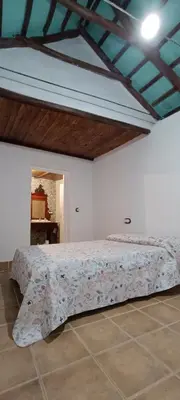Cama o camas de una habitación en El Cortijillo de la Marquesa
