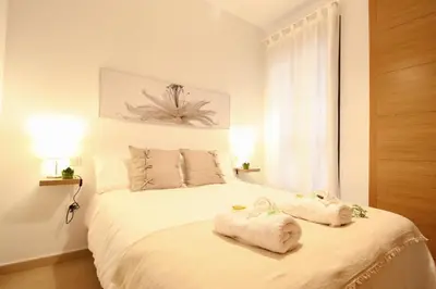 Cama o camas de una habitación en Apartamento en sevilla- San julian