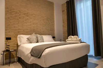 Cama o camas de una habitación en Alojamientos Carola Baños, 6