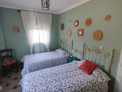 Cama o camas de una habitación en El Andén del Hueznar
