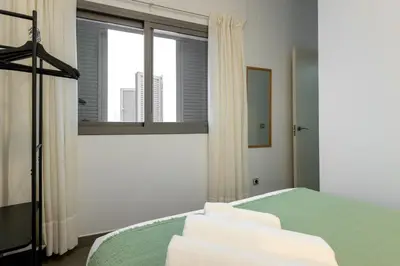 Cama o camas de una habitación en ISG Apartments Palacios Malaver 23