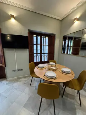 Una televisión o centro de entretenimiento en Makao Alameda 2 BR Apartment