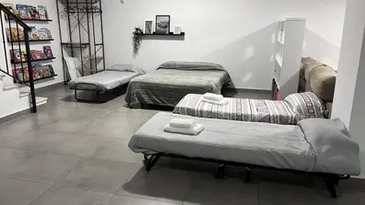 Cama o camas de una habitación en Apartamento La Roldana, con Patio 50 mts VUT-SE-15216