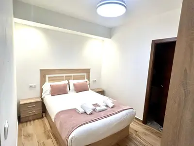 Cama o camas de una habitación en Paradise Home