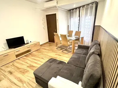 Una televisión o centro de entretenimiento en Paradise Home