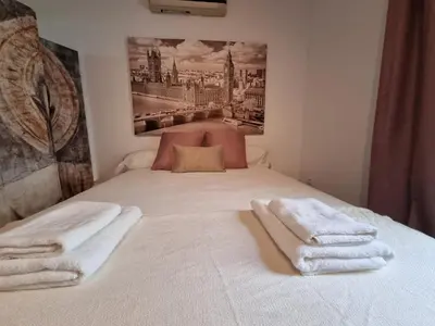 Cama o camas de una habitación en Estudio Alfalfa