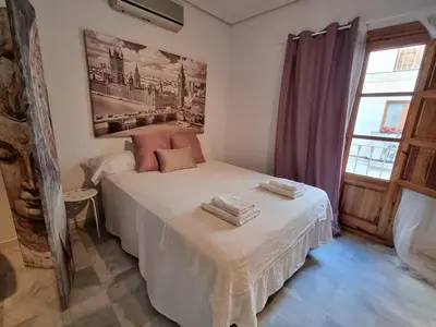 Cama o camas de una habitación en Estudio Alfalfa