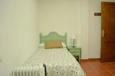 Cama o camas de una habitación en Casa rural en Granada