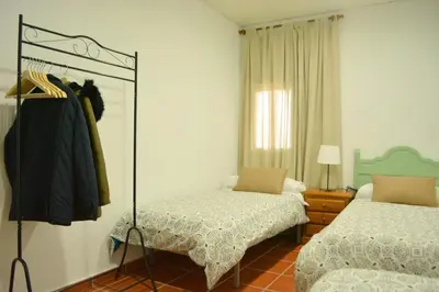 Cama o camas de una habitación en Casa rural en Granada