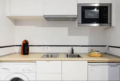 Una cocina o zona de cocina en Conde Suite Courtyard by Valcambre
