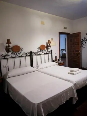 Cama o camas de una habitación en Hostal Casa Inés La Valerosa