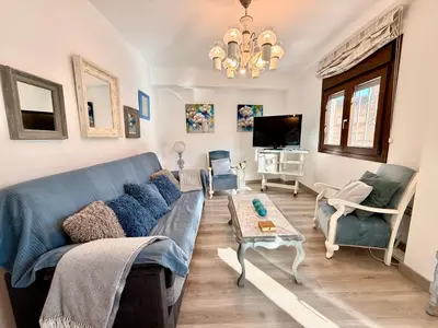 Una televisión o centro de entretenimiento en Apartamento con vistas a la Alcazaba