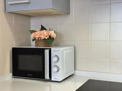 Una televisión o centro de entretenimiento en Apartamento El Alma de Santa Marina