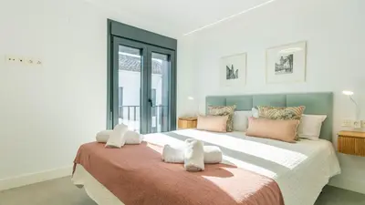 Cama o camas de una habitación en Apartamentos Medina Suites Cordoba
