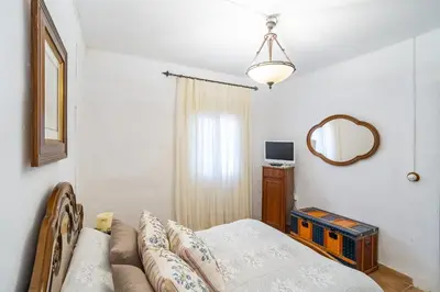 Una televisión o centro de entretenimiento en Cubo's Cortijo La Olivera