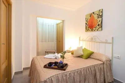 Cama o camas de una habitación en Casa Turística Patio Cordobés - Parking privado en la Judería