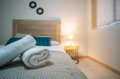 Cama o camas de una habitación en Apartamentos La Piconera