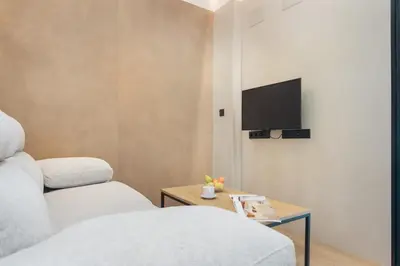 Una televisión o centro de entretenimiento en Panther Home Puerta Osario