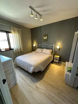 Cama o camas de una habitación en Sueños de Sol Casco Histórico