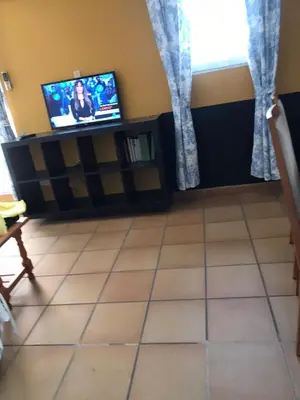 Una televisión o centro de entretenimiento en Terraza Apartment Cristo