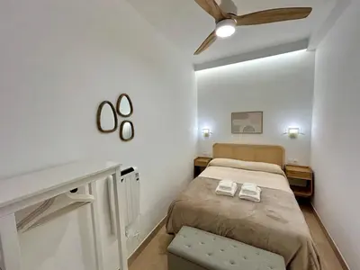 Cama o camas de una habitación en Acogedor apt 6pax 3Bdr 2Bth - CozyHomeSevilla10
