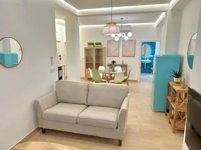 Zona de estar de Acogedor apt 6pax 3Bdr 2Bth - CozyHomeSevilla10